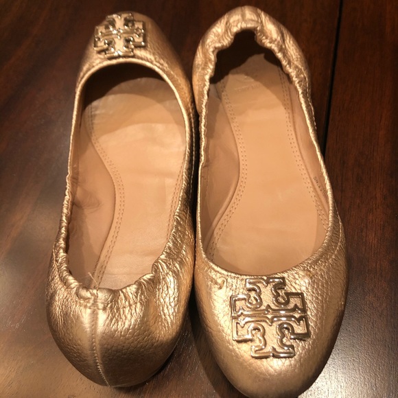 Tory Burch Shoes - Tory Burch Reva flats in gold with gold emblems.